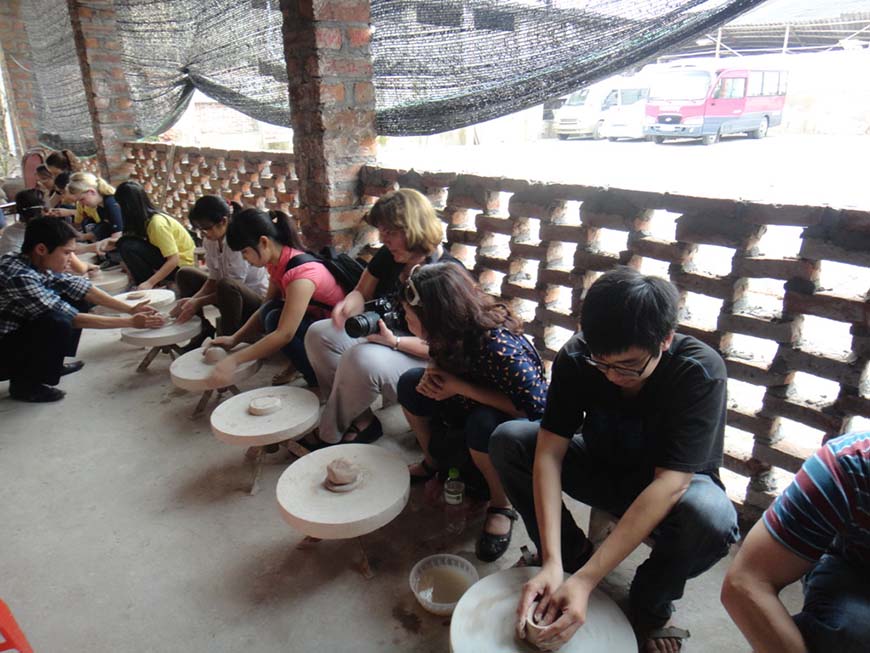 Visitors try making their own ceramic product
